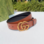 Tan leather belt with gold-tone buckle and adjustable holes