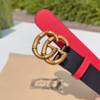 Gucci leather belt close-up: gold double-G buckle and red leather underside