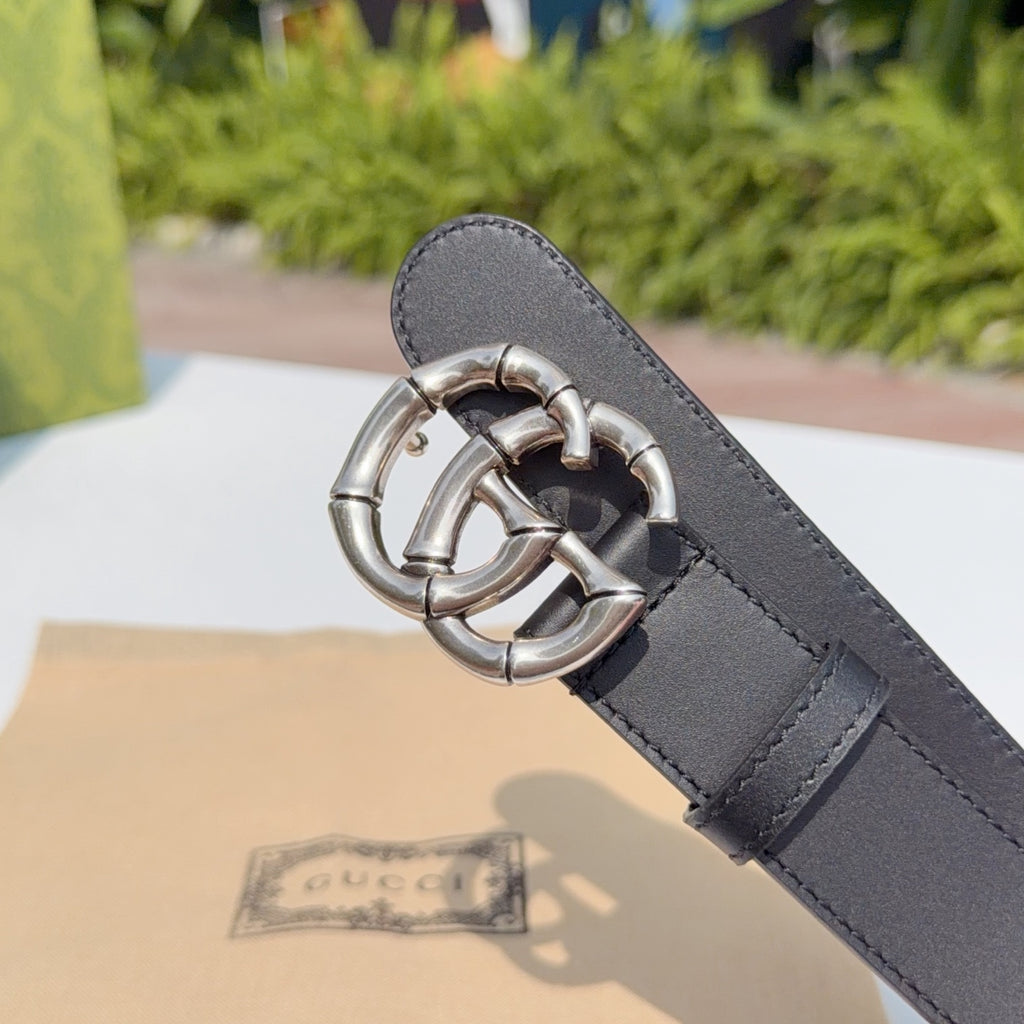 Gucci belt end with dark leather keeper and silver double-G buckle