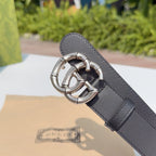 Gucci belt end with dark leather keeper and silver double-G buckle