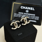 Chanel gold-tone CC logo earrings with raised links and pearl-like bead accents