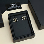 Chanel CC logo stud earrings in gold tone with pearl-like bead accents