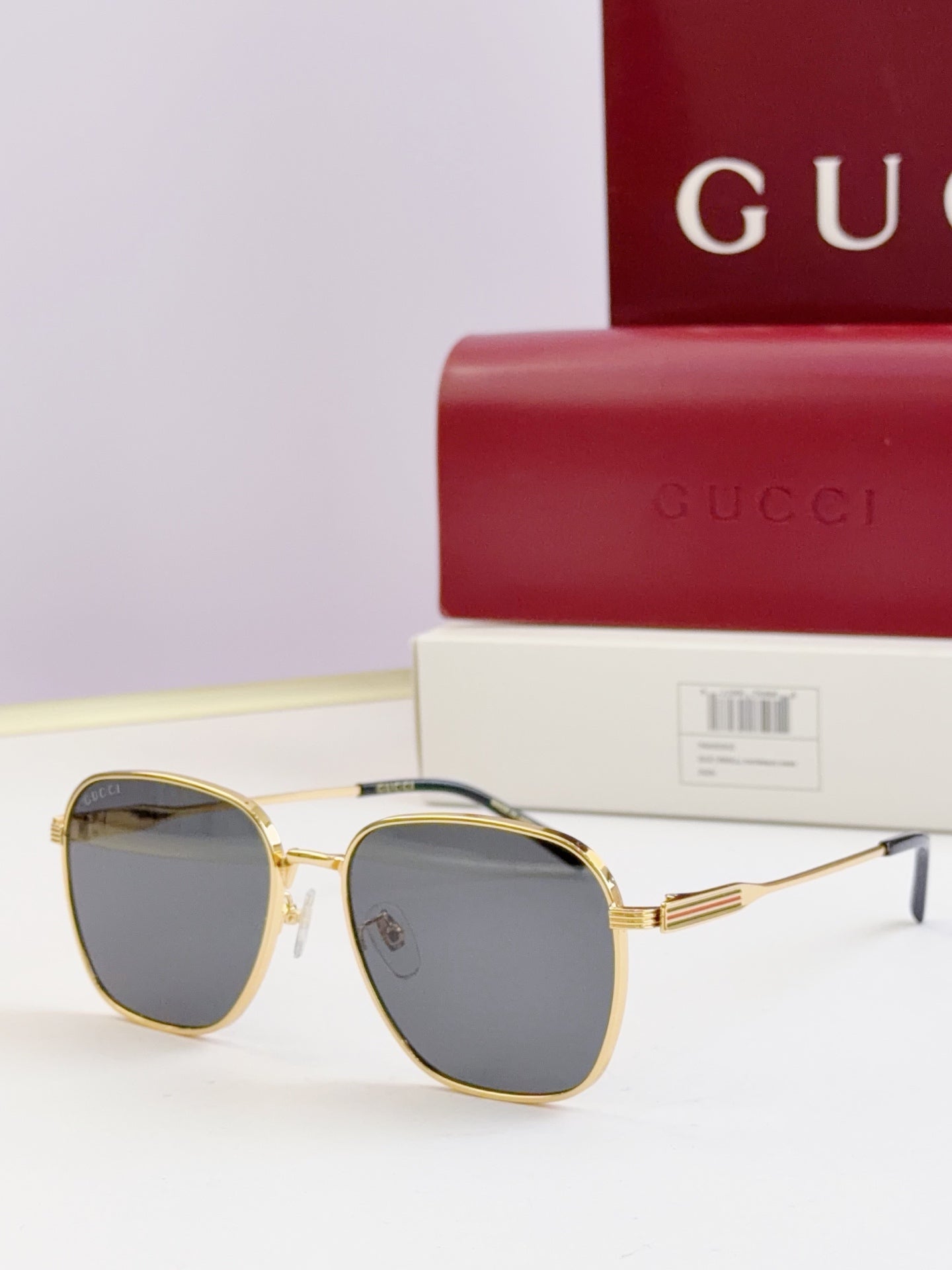 Gucci glasses with dark lenses and gold round frames