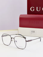 Gucci glasses with clear lenses and dark metal round frames