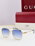 Gucci glasses with blue-tinted lenses and gold round frames