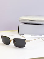 Sunglasses with dark lenses and gold-tone rectangular frame
