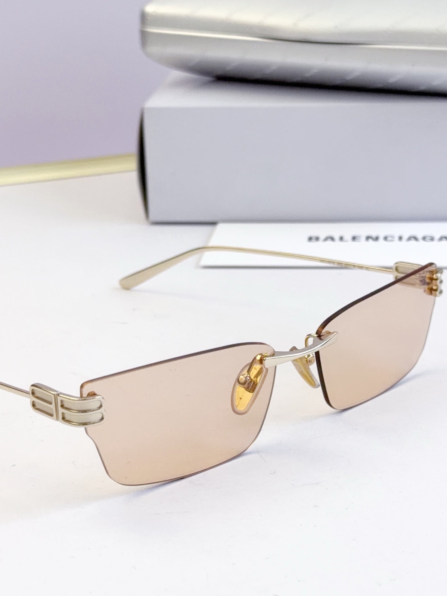 Sunglasses with light tan lenses and gold-tone thin metal frame