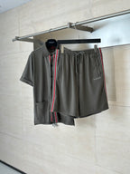Dark gray Gucci shorts with drawstring, elastic waist, and red-green side stripe