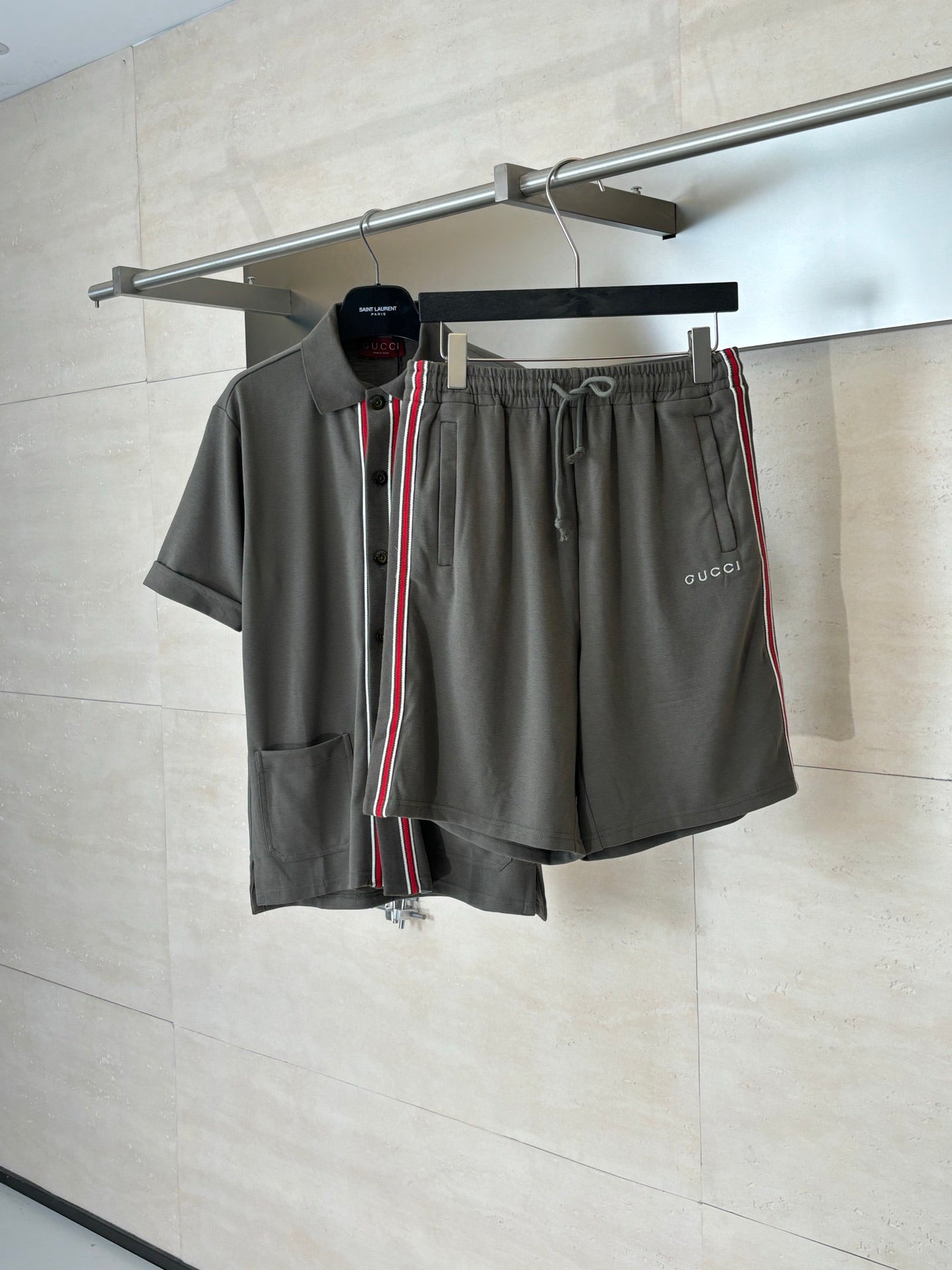 Dark gray Gucci shorts with drawstring, elastic waist, and red-green side stripe