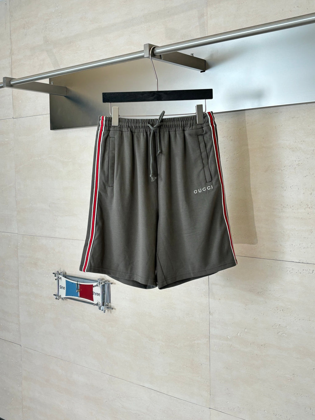 Dark gray Gucci drawstring shorts with elastic waistband and side web stripe