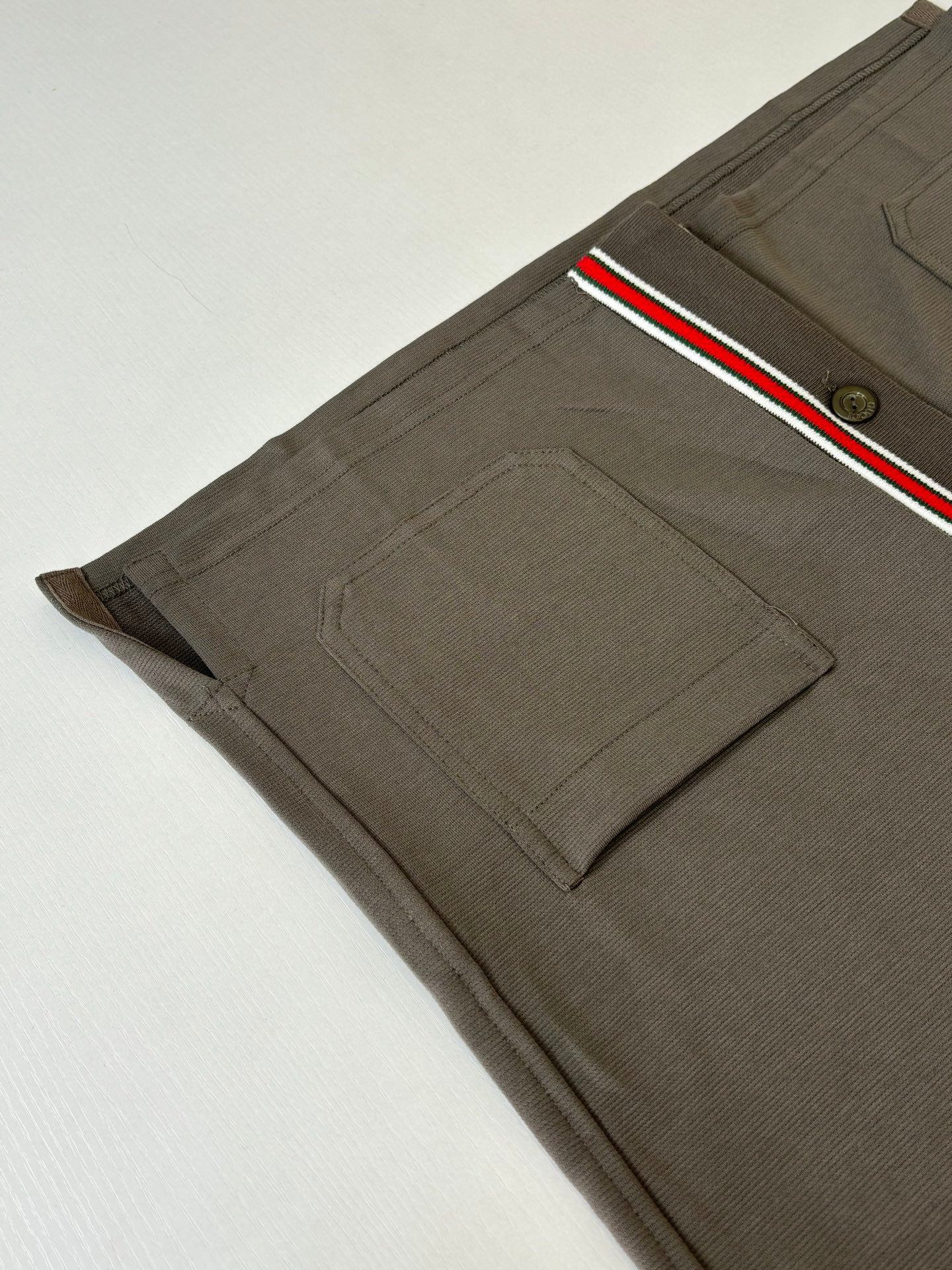 Gucci dark gray shorts with side pocket detail and red/green/white stripe trim