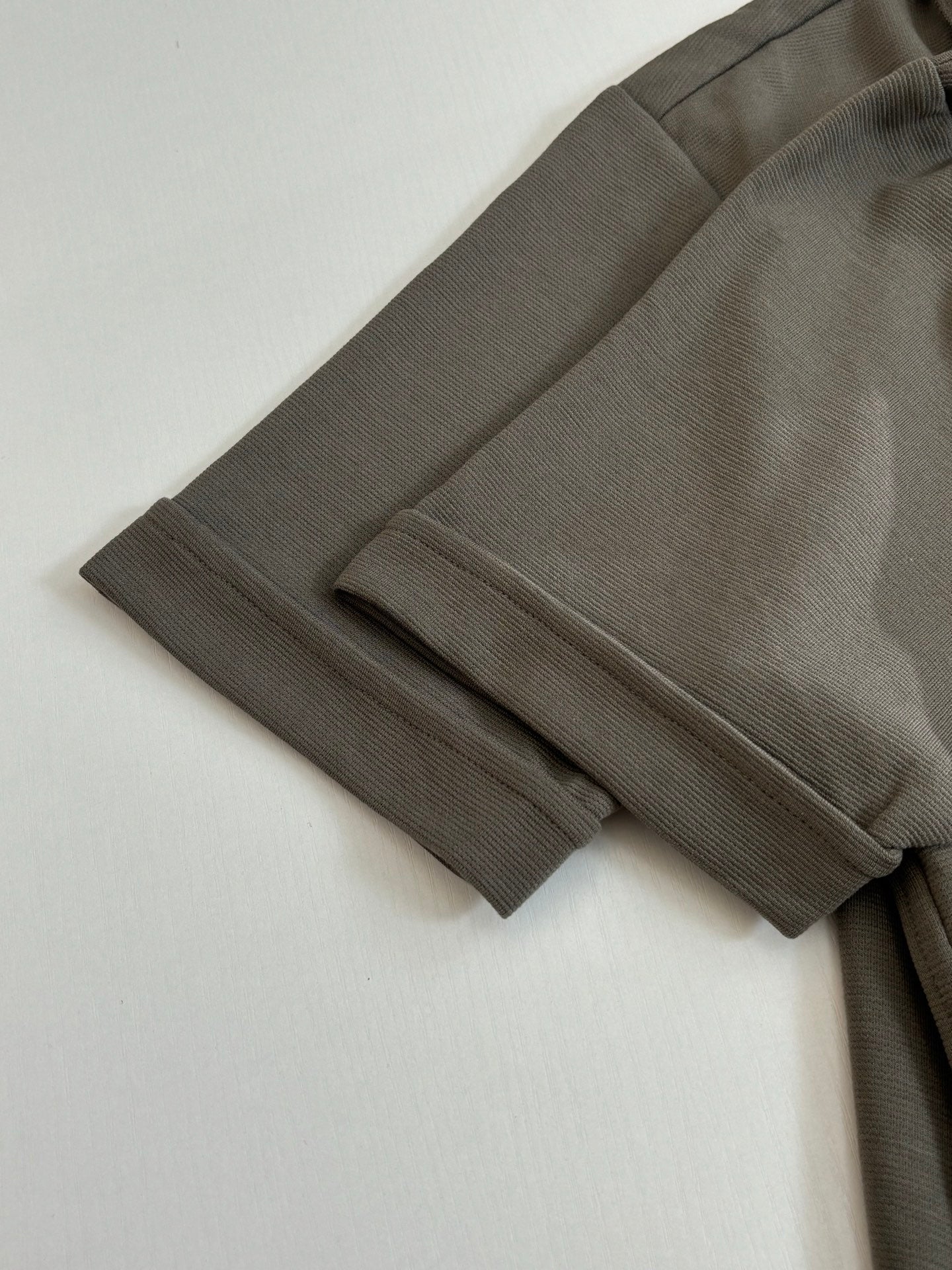 Dark gray shorts with ribbed cuffs and side seams