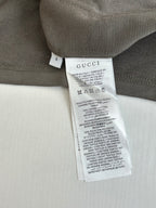 Dark gray Gucci shorts with interior size and care label