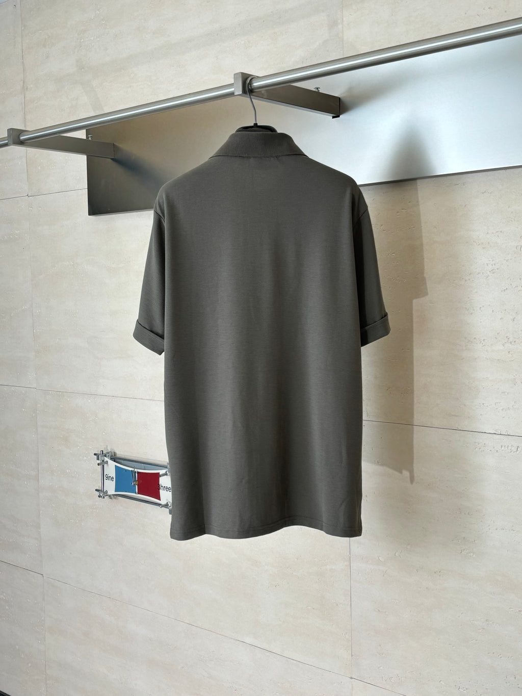 Gucci dark gray short-sleeve shirt, back view on a hanger