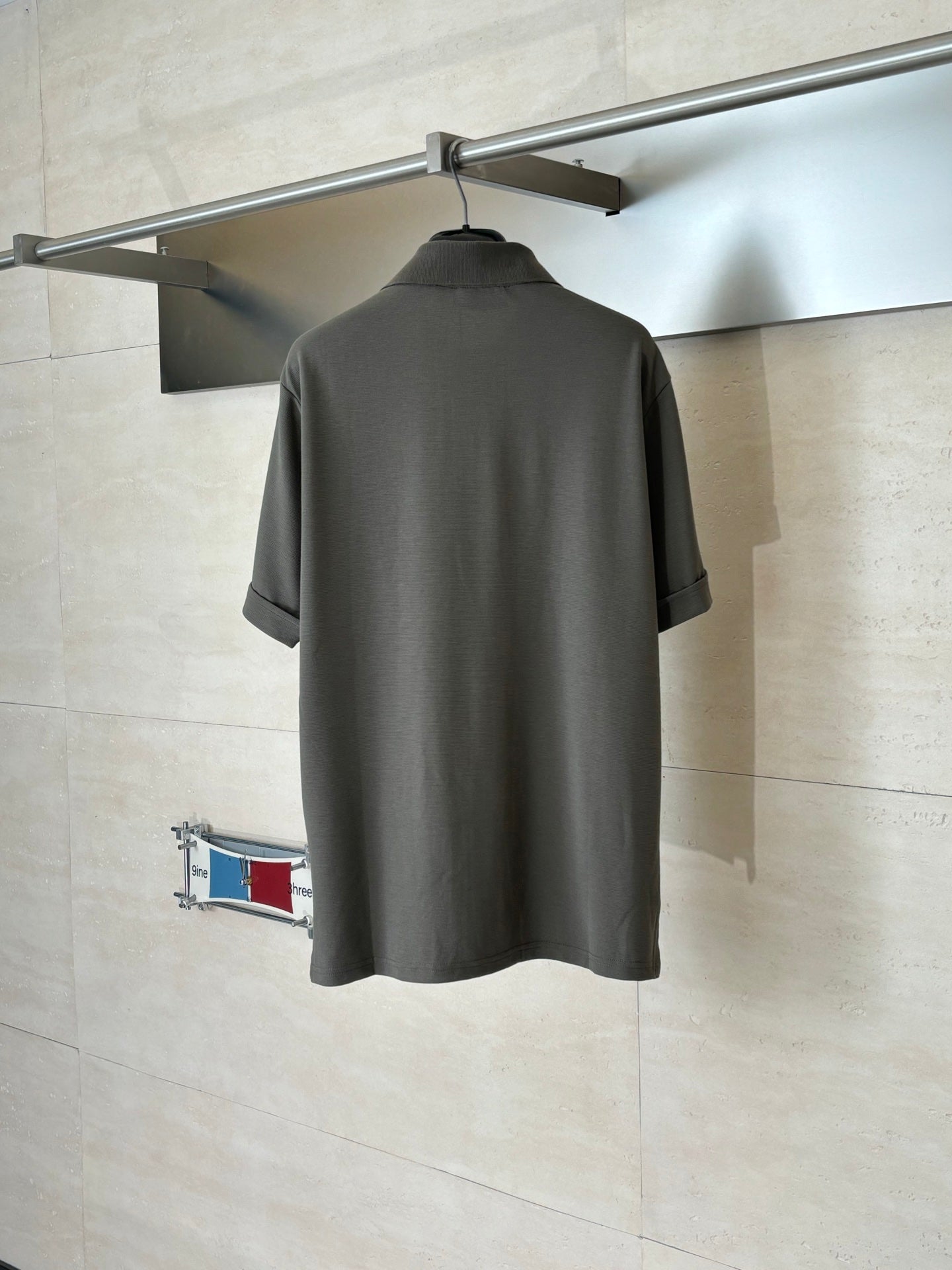 Gucci dark gray short-sleeve shirt, back view on a hanger