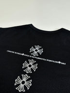 Black long-sleeve shirt with three white flower graphics on back