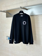 Black long-sleeve crewneck shirt with white circular front graphic
