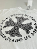 White long-sleeve T-shirt with large black cross graphic on front.