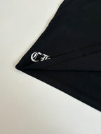 Black long-sleeve cuff with small embroidered logo detail
