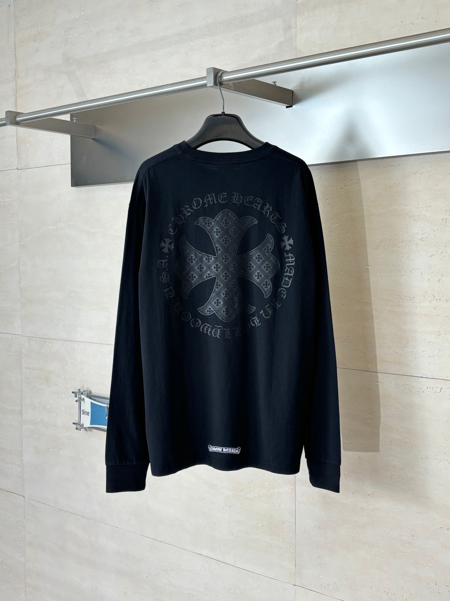Black long-sleeve top with large back graphic print