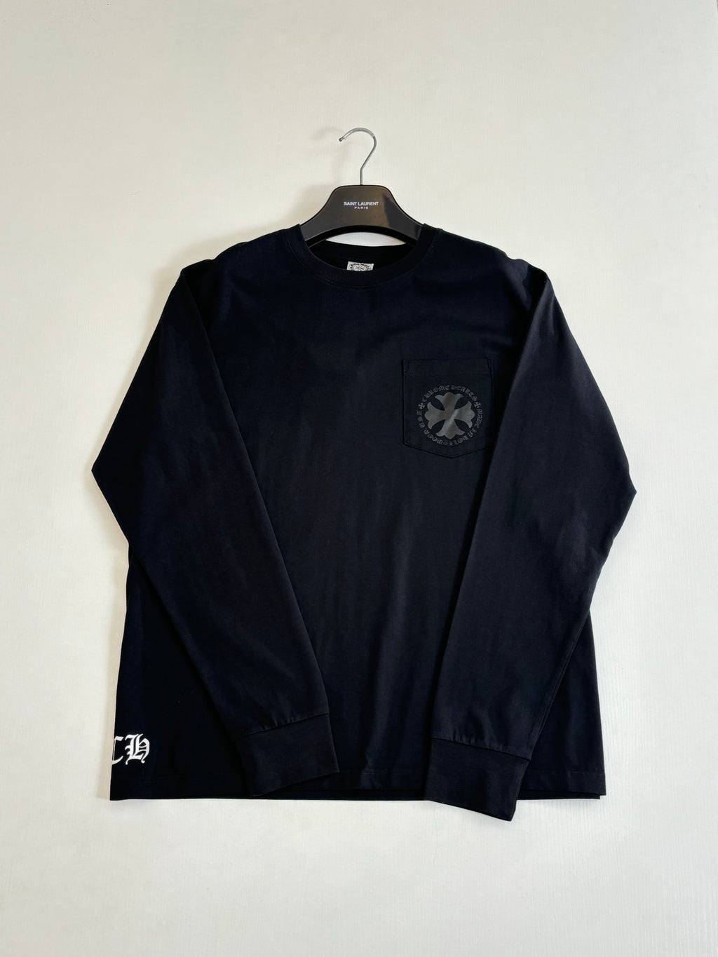 Black long-sleeve sweatshirt with small chest pocket and logo