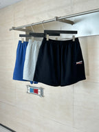 Set of drawstring shorts in black and blue-gray tones on hangers