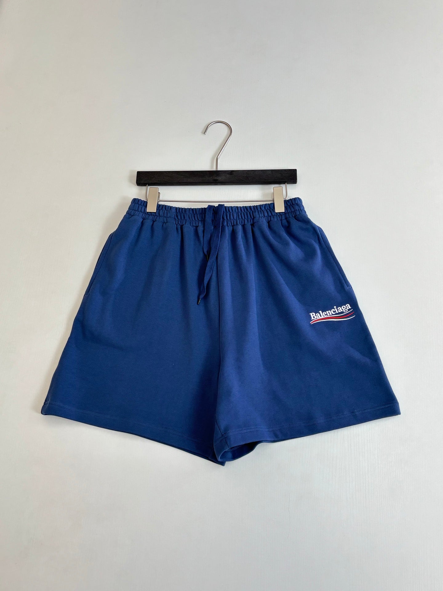 Balenciaga blue shorts with drawstring tie and side logo patch