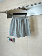 Gray heather shorts on hanger, elastic waistband and drawstring with Balenciaga logo