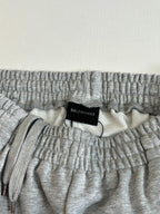 Gray heather shorts waistband close-up with black Balenciaga size label