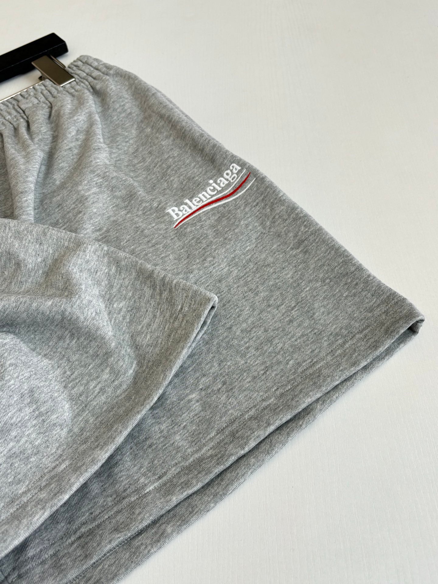 Gray heather shorts with drawstring and Balenciaga logo near side hem