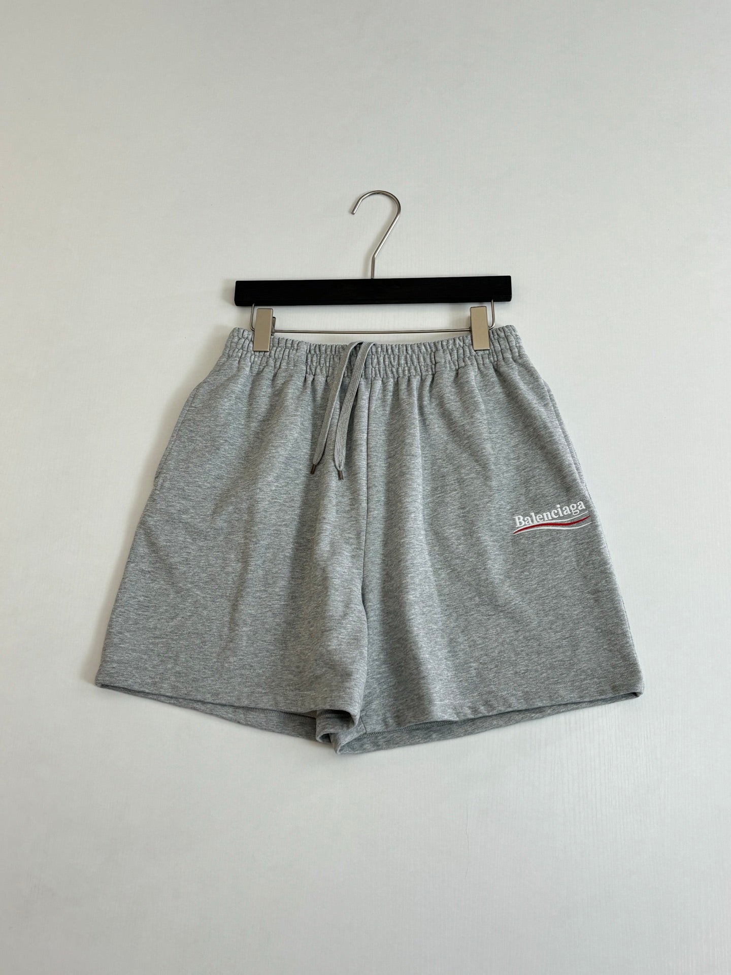Balenciaga heather gray drawstring shorts with front slit pockets and logo patch