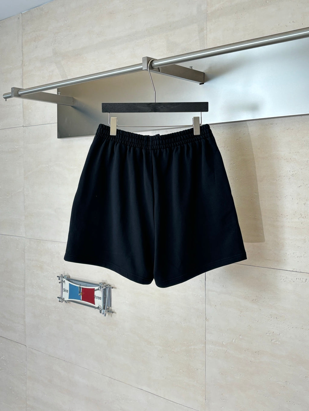 Navy drawstring shorts with elastic waistband and Balenciaga logo patch