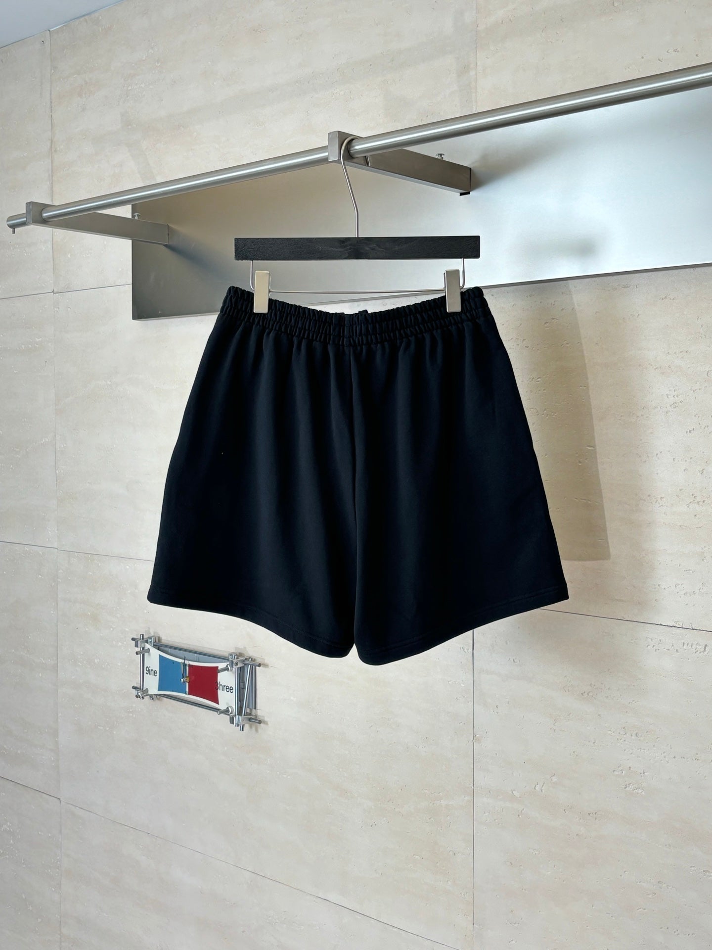 Navy drawstring shorts with elastic waistband and Balenciaga logo patch