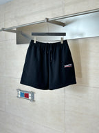 Black drawstring shorts with elastic waistband and Balenciaga logo patch