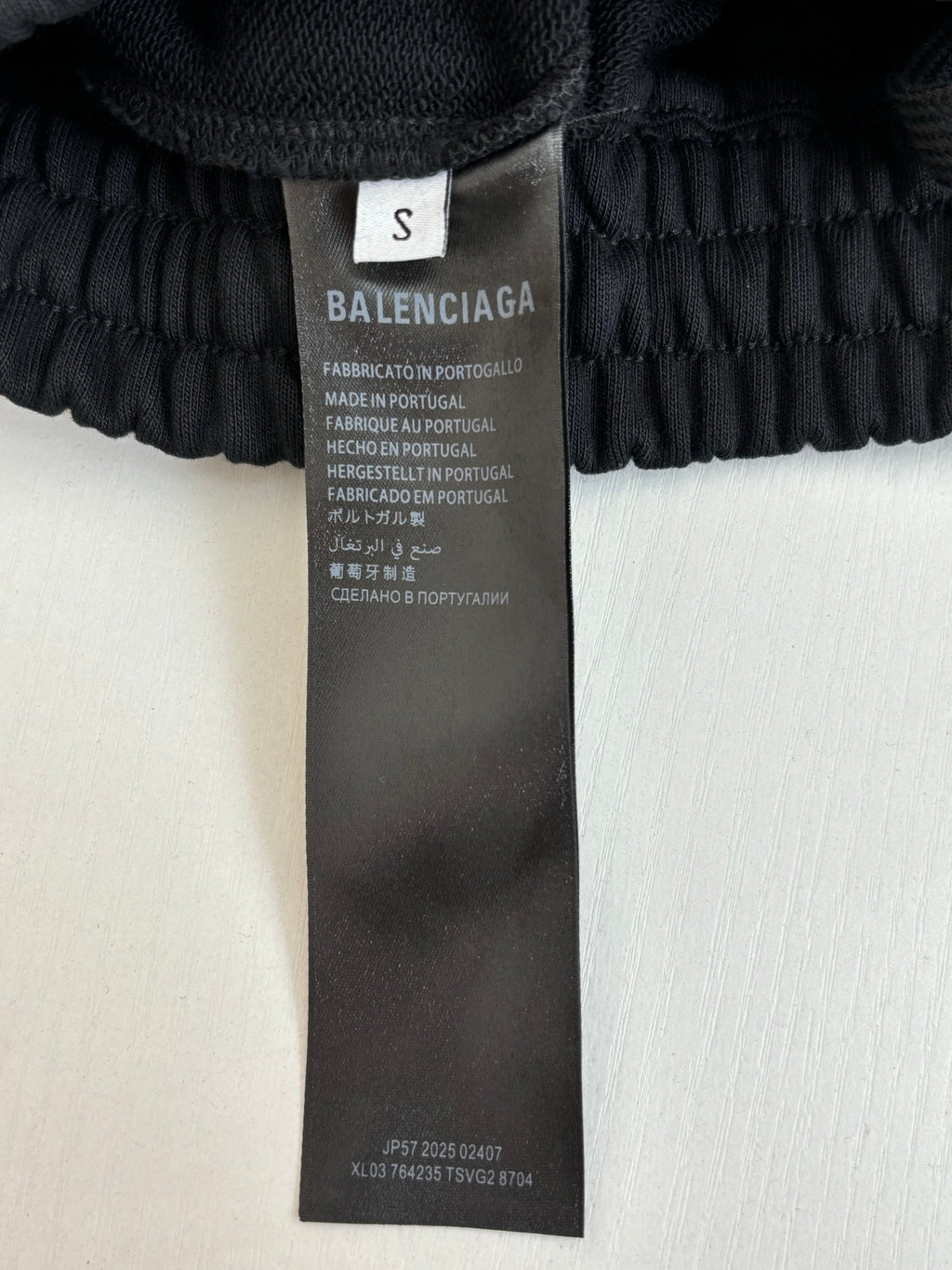 Black drawstring shorts fabric care label on inner waistband