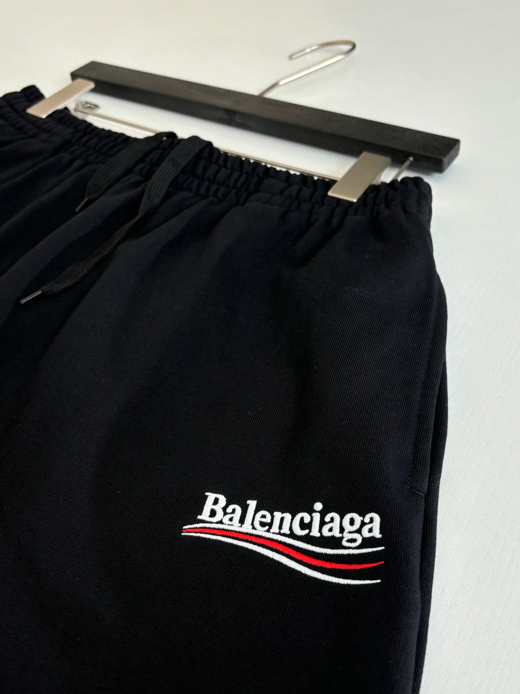 Black drawstring shorts with Balenciaga logo print on front