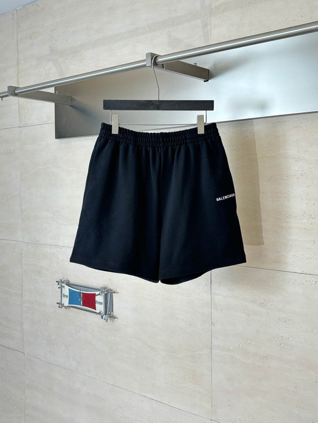 Balenciaga black shorts with elastic waistband and subtle logo on the right side