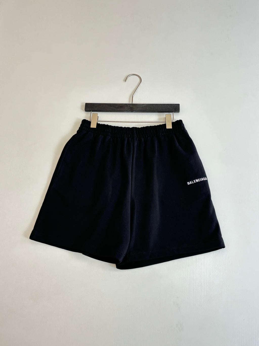 Black drawstring style shorts with elastic waist and BALENCIAGA logo patch