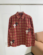 Red plaid long-sleeve shirt with button front and black/white cross patches