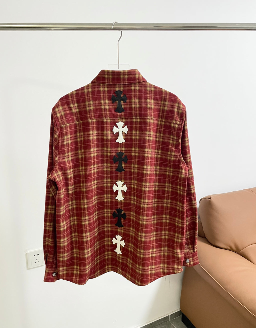 Red plaid long-sleeve shirt back with vertical cross applique rows