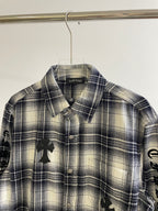 Blue plaid button-up shirt with spread collar and black embroidered front details