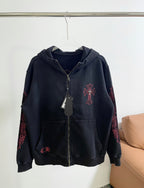 Dark zip-up hoodie with hood and front cross emblem in red embroidery