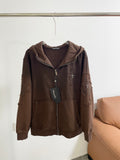 Brown zip-up hoodie with hood, embroidered cross-and-floral details on front