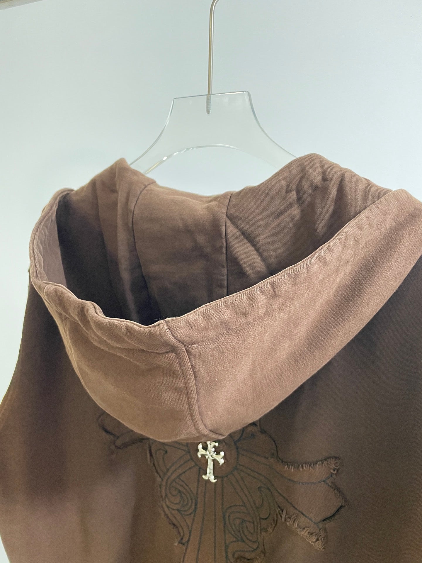 Taupe long hooded sweatshirt with embroidered crest on chest