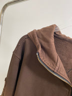 Brown hoodie shoulder and hood with gold zipper trim