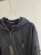 Dark hoodie jacket with zip front, hood, ribbed cuffs, and cross emblem at chest