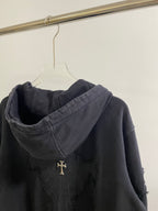 Dark back of hooded zip-up hoodie with cross emblem embroidery on upper back