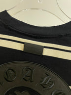 Navy striped long-sleeve shirt with woven label at neckline and textured crest patch