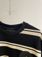Ribbed crew-neck navy striped long-sleeve shirt with dark crest patch detail