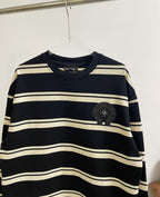 Navy striped long-sleeve shirt with ribbed crew neck and black crest patch